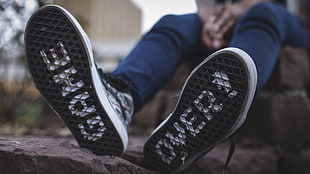 pair of black-and-white low top sneakers, shoes, photography, people
