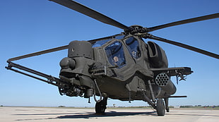 military helicopter under blue sky