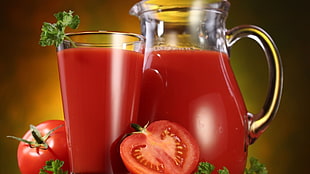 Tomato juice in glass of pitcher