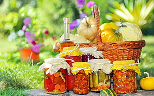 six food jars beside basket