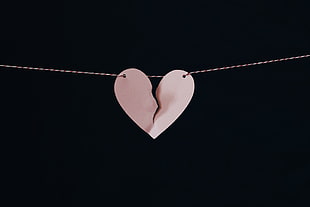 silver-colored necklace with cracked heart pendant