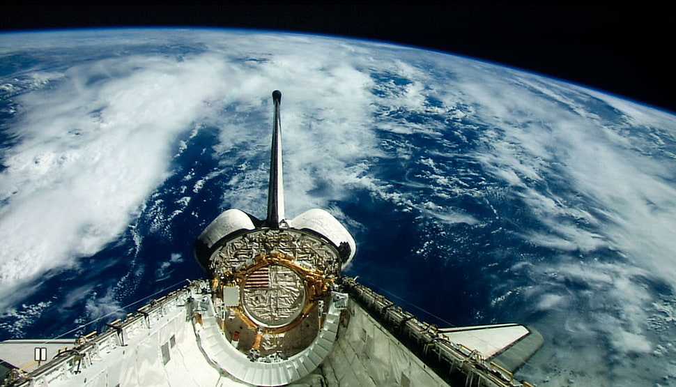white spacecraft floating above planet earth HD wallpaper
