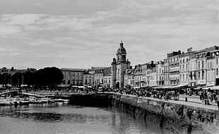 grayscale photo of concrete structure beside body of water, monochrome, la rochelle, France, old