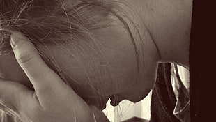 sepia photography of a woman holding her forehead HD wallpaper