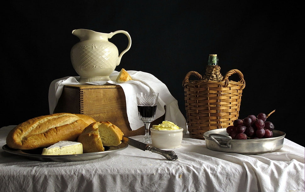 slice loaf with glass of wine. grapes, basket and pitcher on table set HD wallpaper
