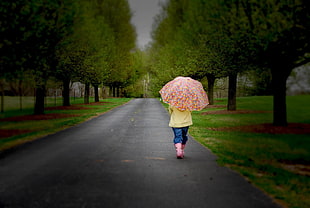 girl walking on gray path road HD wallpaper