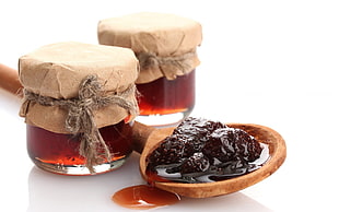 mulberries syrup on brown wood ladle