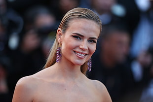 woman with purple earrings