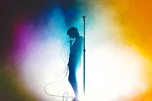 man holding corded microphone wallpaper, concerts, silhouette, Lauren Mayberry, Chvrches