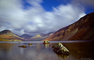 in distance photo of mountains and body of water, wastwater