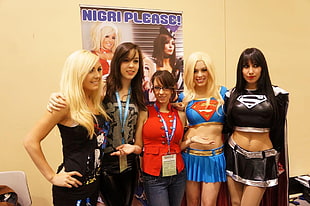 woman in Supergirl costume near woman in black Supergirl costume HD wallpaper