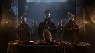 five people wearing silver masks