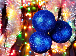three blue Christmas ornaments HD wallpaper