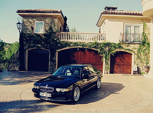 black sedan parked during daytime