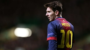 selective focus photography of Messi soccer player
