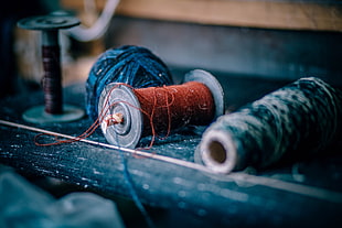 two spool of brown and black laces
