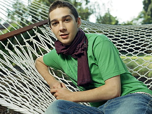 men's green crew-neck t-shirt and maroon scarf