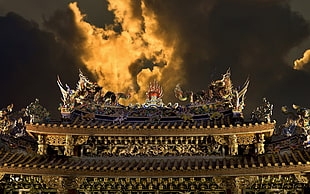 brown and gray roof with dragon figure