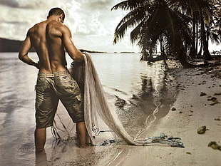 men's gray shorts, fishnets, sand, water, beach