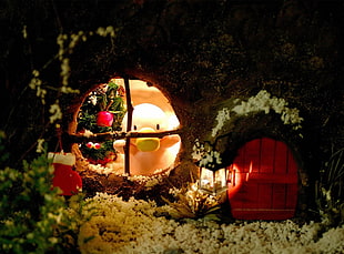 depth of field photography of snowman looking on window