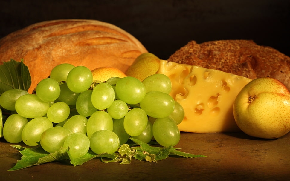 cluster of green grapes on brown surface HD wallpaper