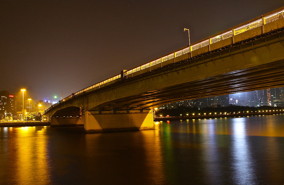 grey concrete bridge during nighttime HD wallpaper