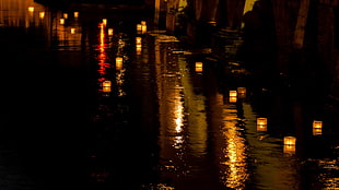 glass votive candles, lantern, river, night