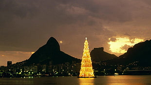 mountain silhouette and yellow giant Christmas tree, Rio de Janeiro, Brazil, Christmas Tree, bay HD wallpaper
