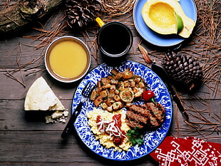 roasted meat with fried egg on white ceramic plate