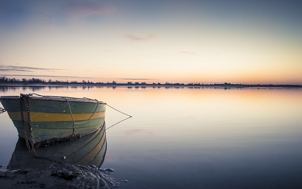 photo of green and beige canoe on clam body of water during golden hour HD wallpaper