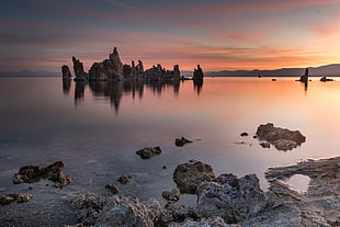 rock formation on body of water during the horizon, mono lake