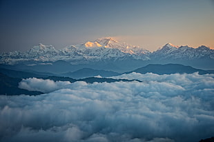 snow covered mountain covered in fogs, landscape, clouds, mountains, snowy peak