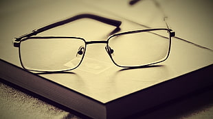 closeup photo of black framed eyeglasses