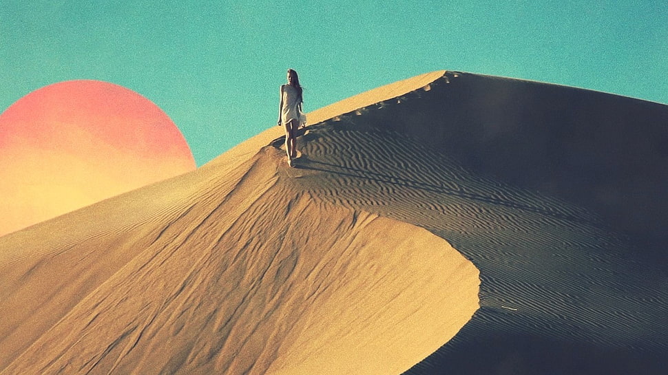 woman standing on desert during daytime HD wallpaper