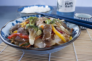 assorted vegetables on white and blue ceramic bowl