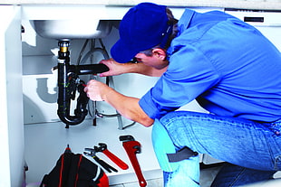 plumber fixing sink pipe HD wallpaper