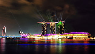 timelapse of Marina Bay Sands Hotel, Marina Bay, lights, ferris wheel, Singapore