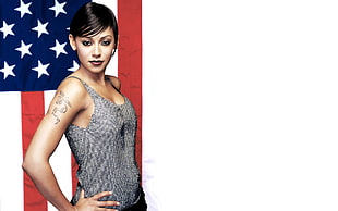 woman in grey sleeveless tops with USA flag background