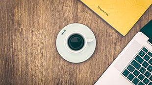 coffee mug and saucer on wooden surface HD wallpaper