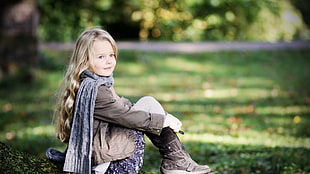 girl sitting wearing gray scarf pgoto