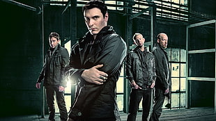 group of men in black jacket