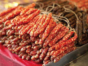 pile of red food on red surface