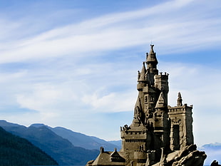 gray castle on top of mountain HD wallpaper