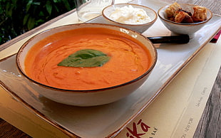 orange sauce served on white ceramic bowl