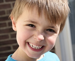 close up photography of smiling boy