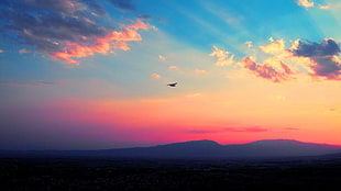 airplane, clouds, sunset, mountains