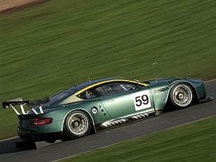 green racing coupe on track HD wallpaper