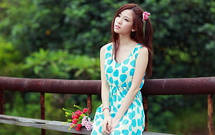 woman in white and blue heart-printed sleeveless dress
