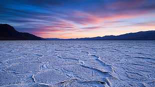snowfield near mountain at golden hour panoramic photography