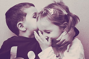 boy kissing forehead og a girl